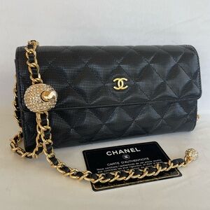 Chanel Black Quilted large Wallet with gold adjustable chain.